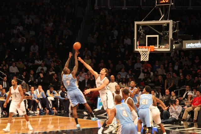 Nets knocked down by Nuggets, home boos