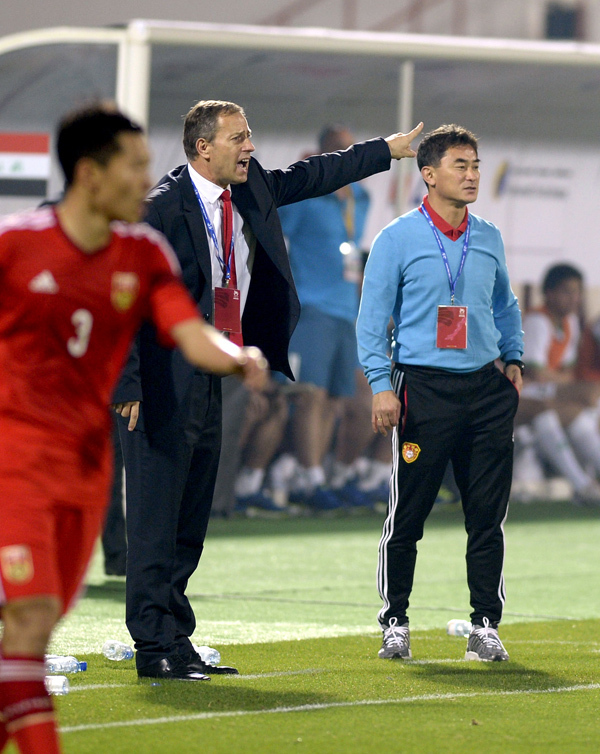 China advance in Asian Cup despite loss