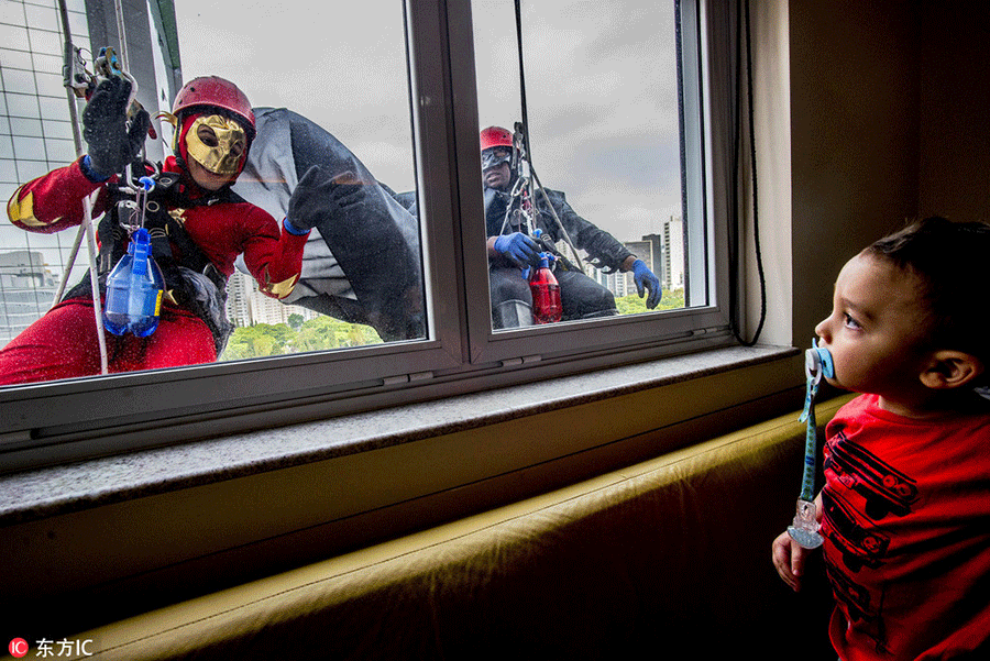 Superheroes cheer up sick children in Sao Paulo