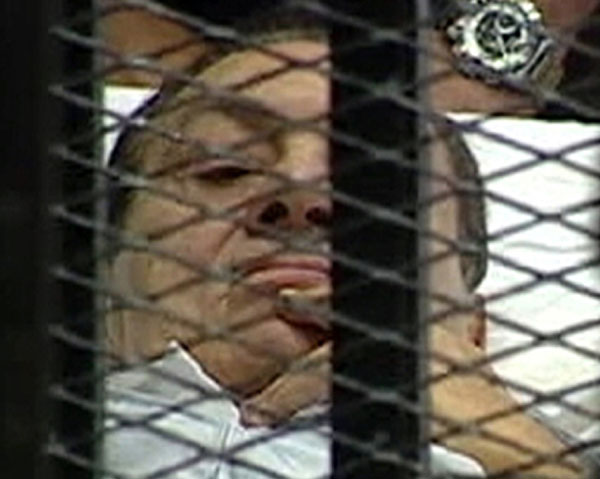 Mubarak wheeled into court in bed for trial