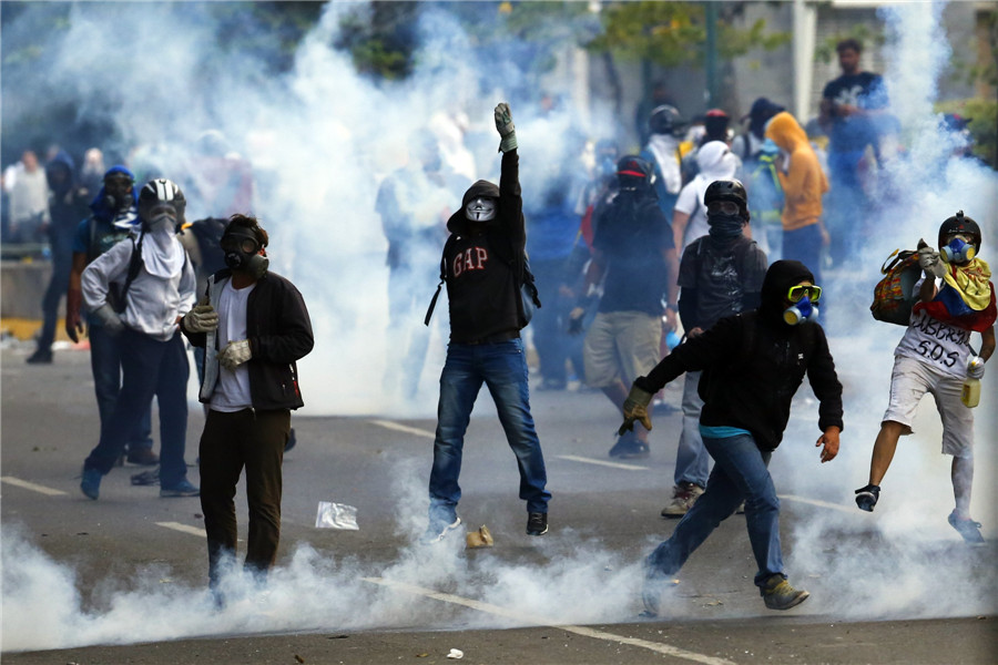 Protesters take part in clashes in Venezuela