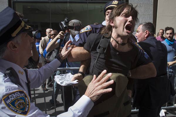 Climate protesters arrested in march on Wall Street