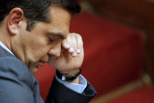 Greek government secures votes to pass bailout in parliament