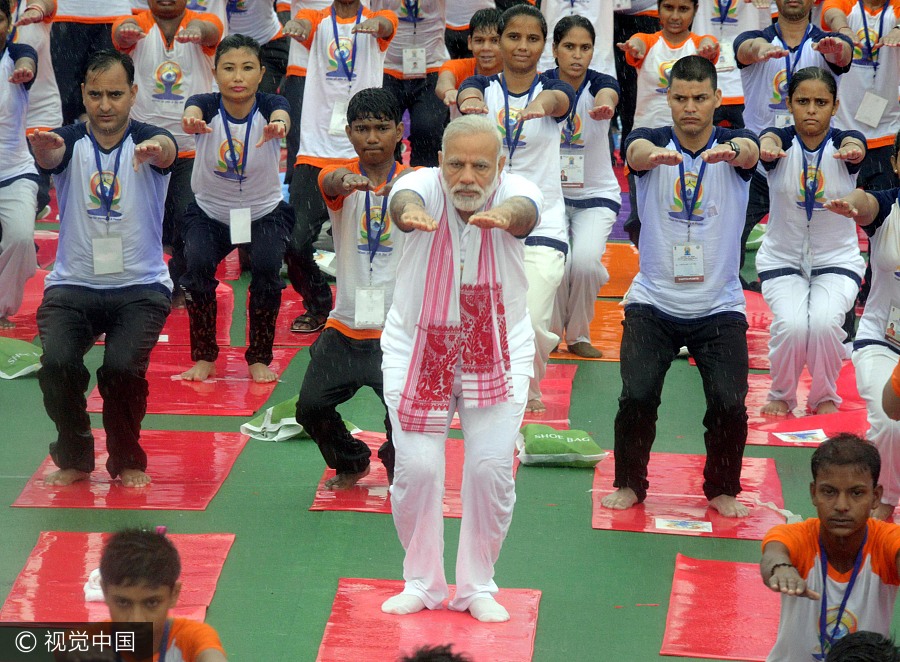 Thousands join India's Modi, hit the mat for International Yoga Day