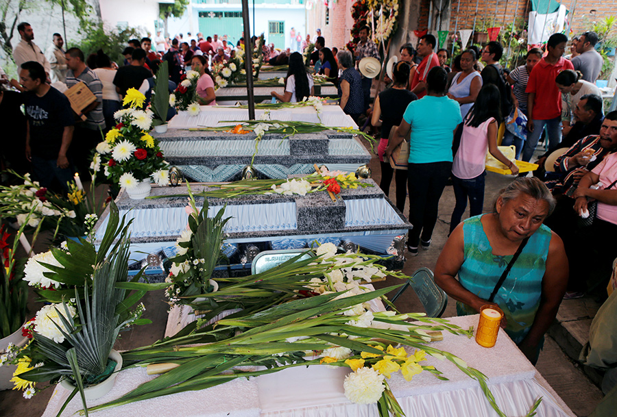 Mexicans dig through collapsed buildings as quake kills 225